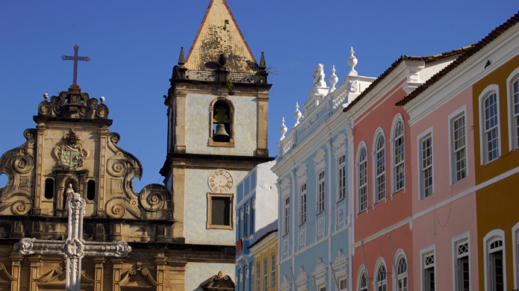 Colorful colonial buildings with baroque features in Pelourinho, Salvador, standing in stark contrast to the clear blue sky.