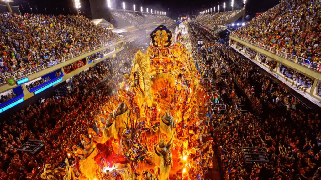 Vibrant night scene of a Brazilian carnival with floats and costumed dancers in the Sambadrome, Rio de Janeiro.