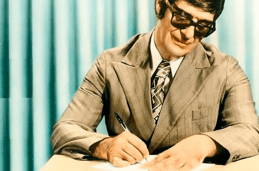 Chico Xavier in a suit signing documents, not directly related to a religious context but possibly depicting a historical figure or a cultural moment in Brazilian history.
